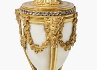A French Louis XVI style three-piece gilt bronze and white marble clock garniture, retailed by Tiffany & Co., New York, NY, late 19th century