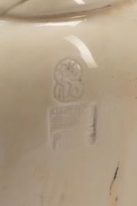 A Chinese Export White Glazed Porcelain Figure of a Seated Luohan