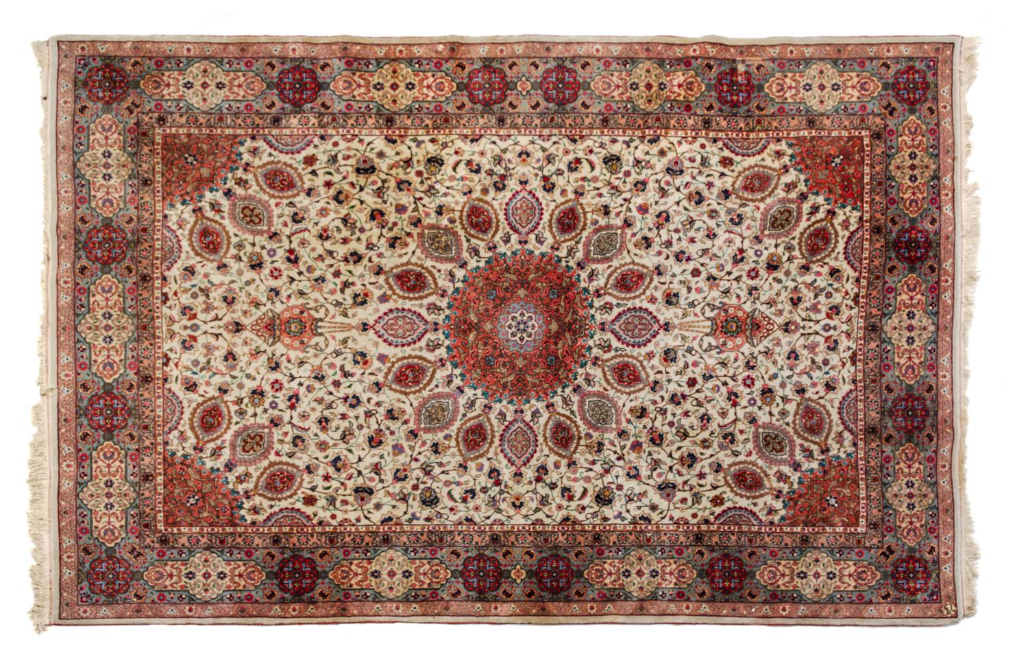 A Tabriz Wool Rug 9 feet 7 inches x 6 feet 8 inches.