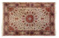 A Tabriz Wool Rug 9 feet 7 inches x 6 feet 8 inches.