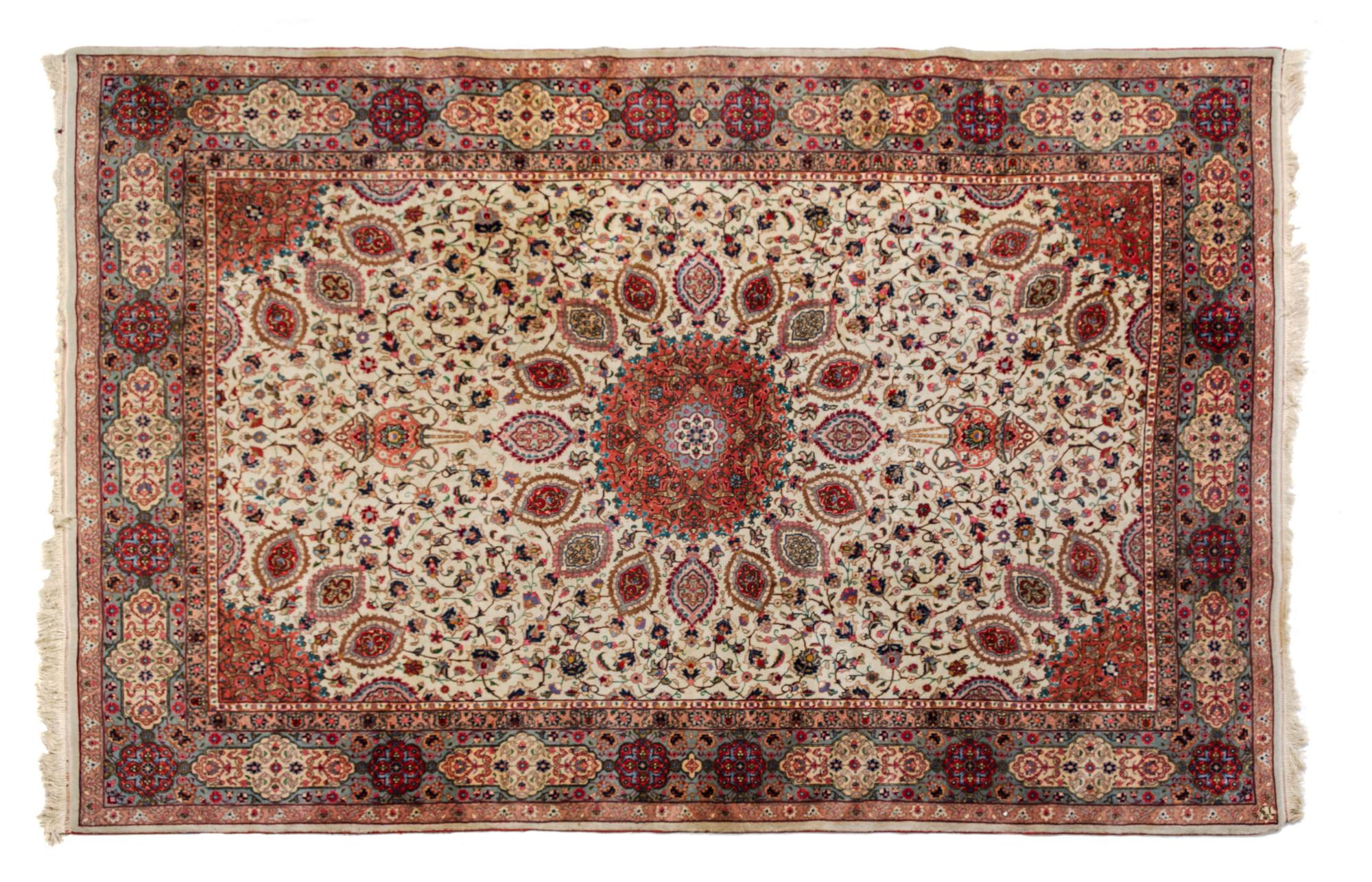 A Tabriz Wool Rug 9 feet 7 inches x 6 feet 8 inches.