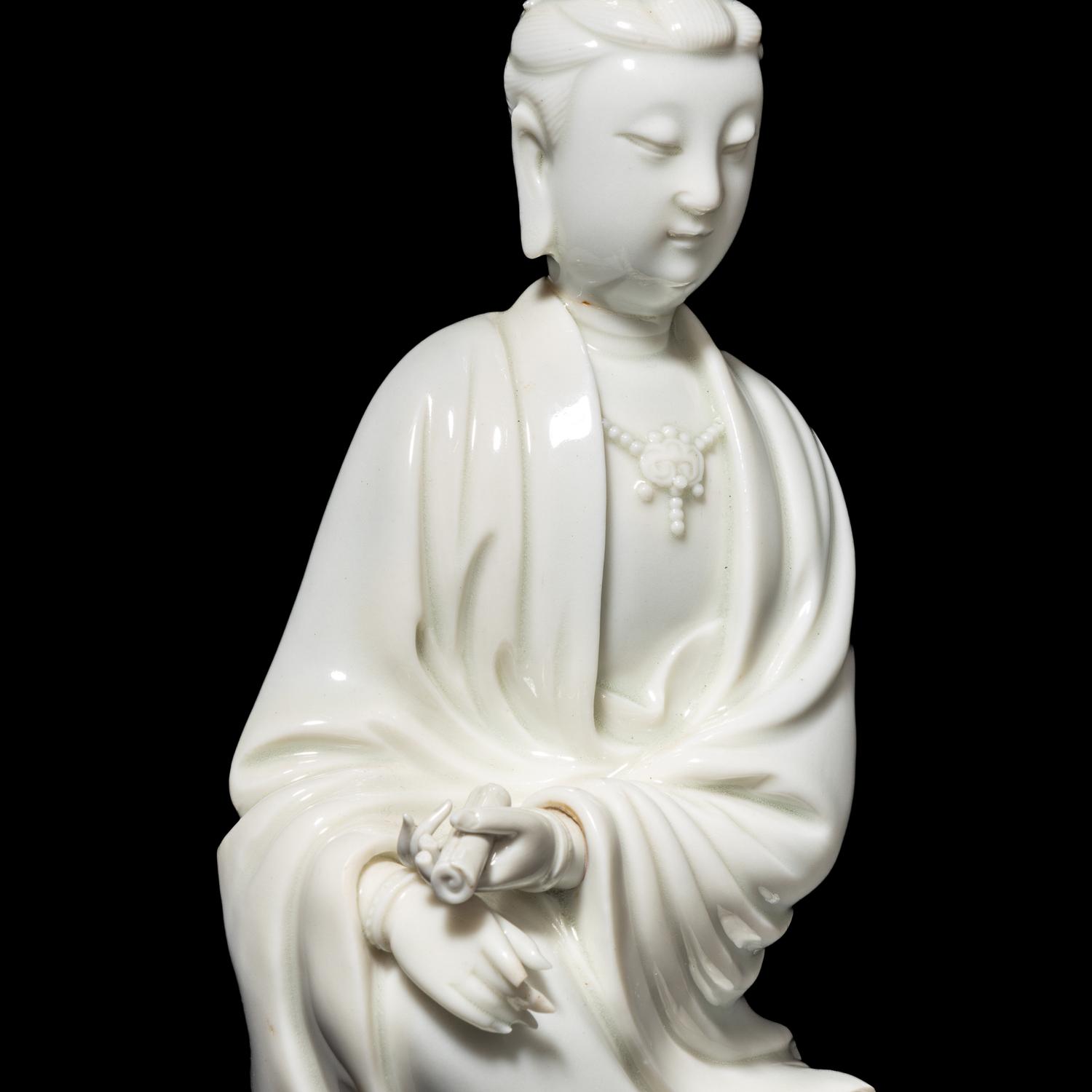 A Chinese Blanc-de-Chine Porcelain Figure of Guanyin, Late Qing/Republic Period 晚清/民國 德化白瓷書卷觀音