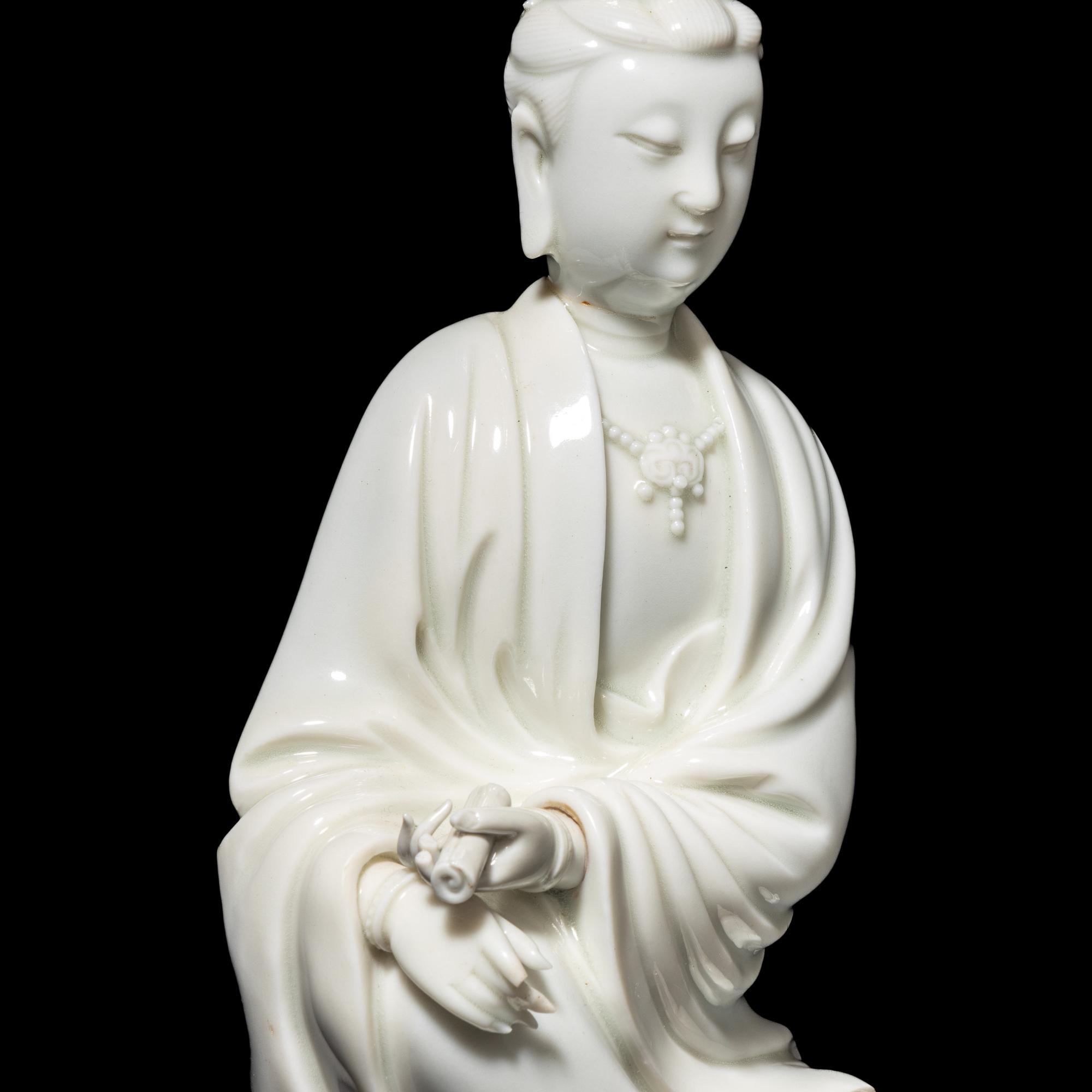 A Chinese Blanc-de-Chine Porcelain Figure of Guanyin, Late Qing/Republic Period 晚清/民國 德化白瓷書卷觀音