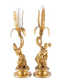 A Pair of Figural Gilt Metal Candlesticks