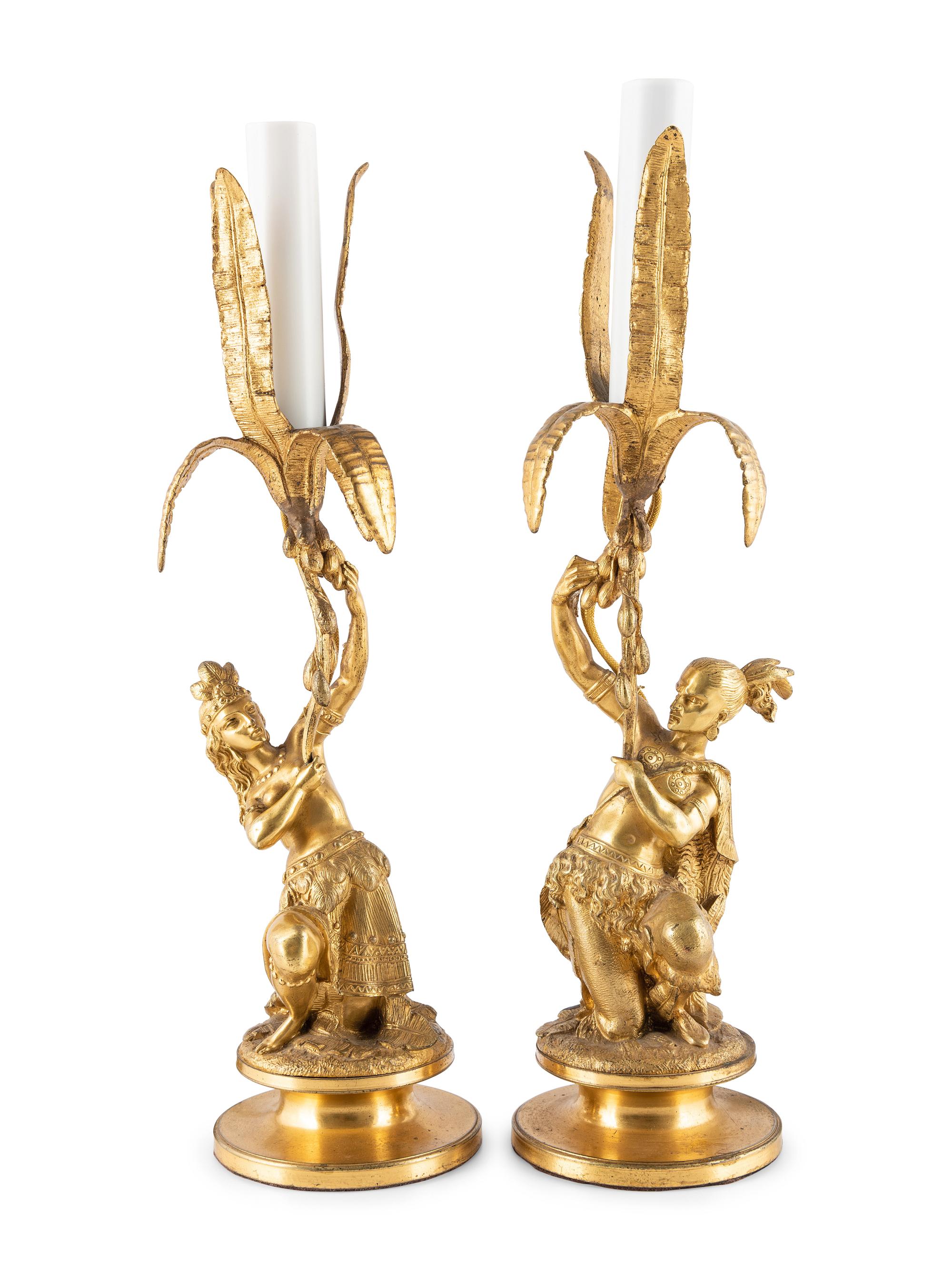 A Pair of Figural Gilt Metal Candlesticks