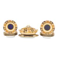 An Aesthetic Movement Parcel-Gilt Porcelain Table Service