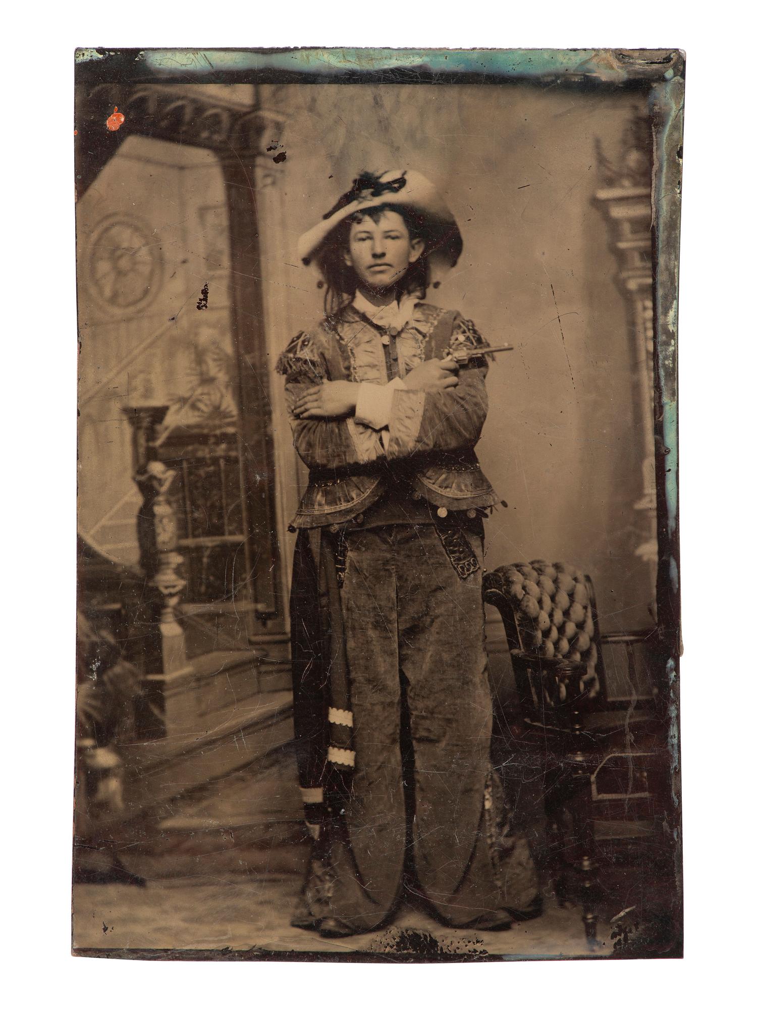 [WESTERN AMERICANA] 16 tintypes of "western" women incl. armed character and Native American subject
