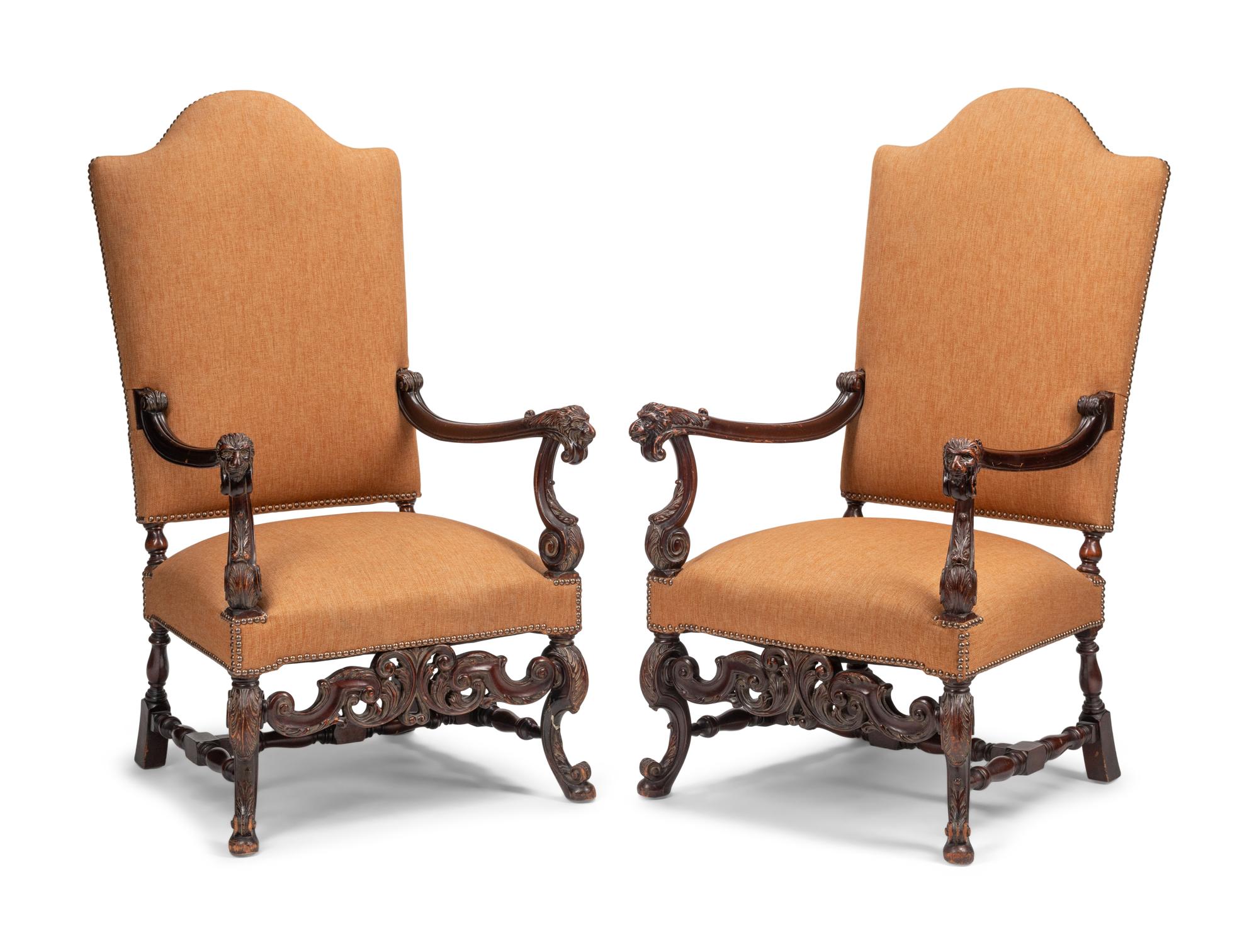 A Pair of William and Mary Style Carved Walnut Armchairs