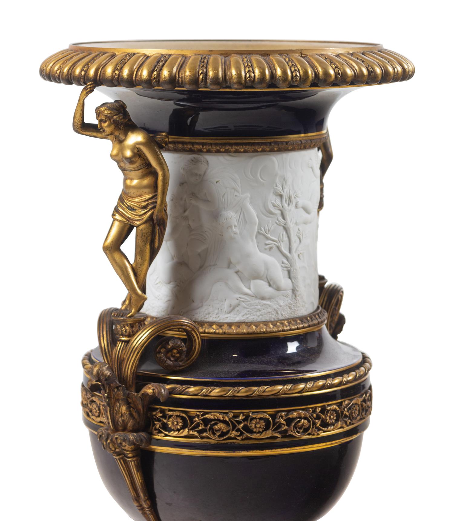 A Pair of French Gilt Bronze Mounted Bisque and Cobalt Glazed Porcelain Urns