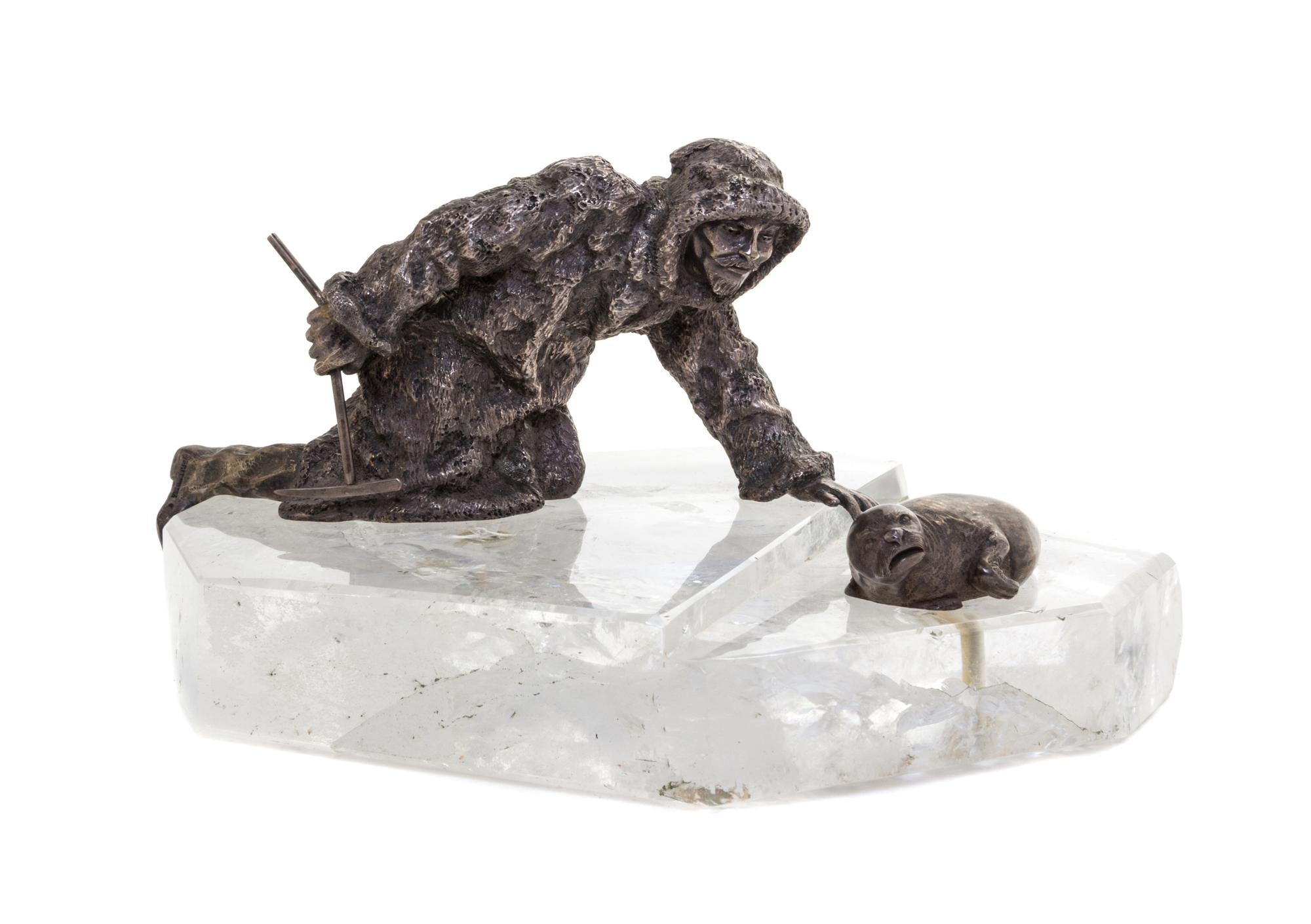 A Russian Silver and Rock Crystal Sculpture, Grachev Brothers, St. Petersburg, Early 20th Century, depicting a seal hunter approaching
