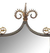 A Continental Brass and Iron Shield-form Mirror