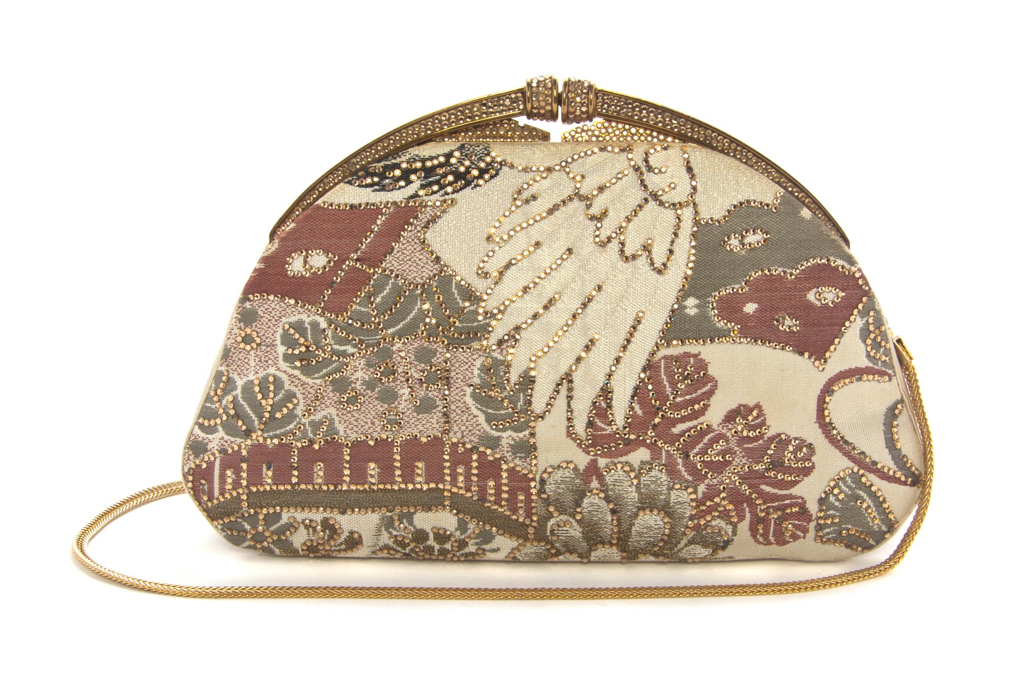 A Judith Leiber Champagne Embroidered Clutch, 9 1/2 x 6 x 1 inches.