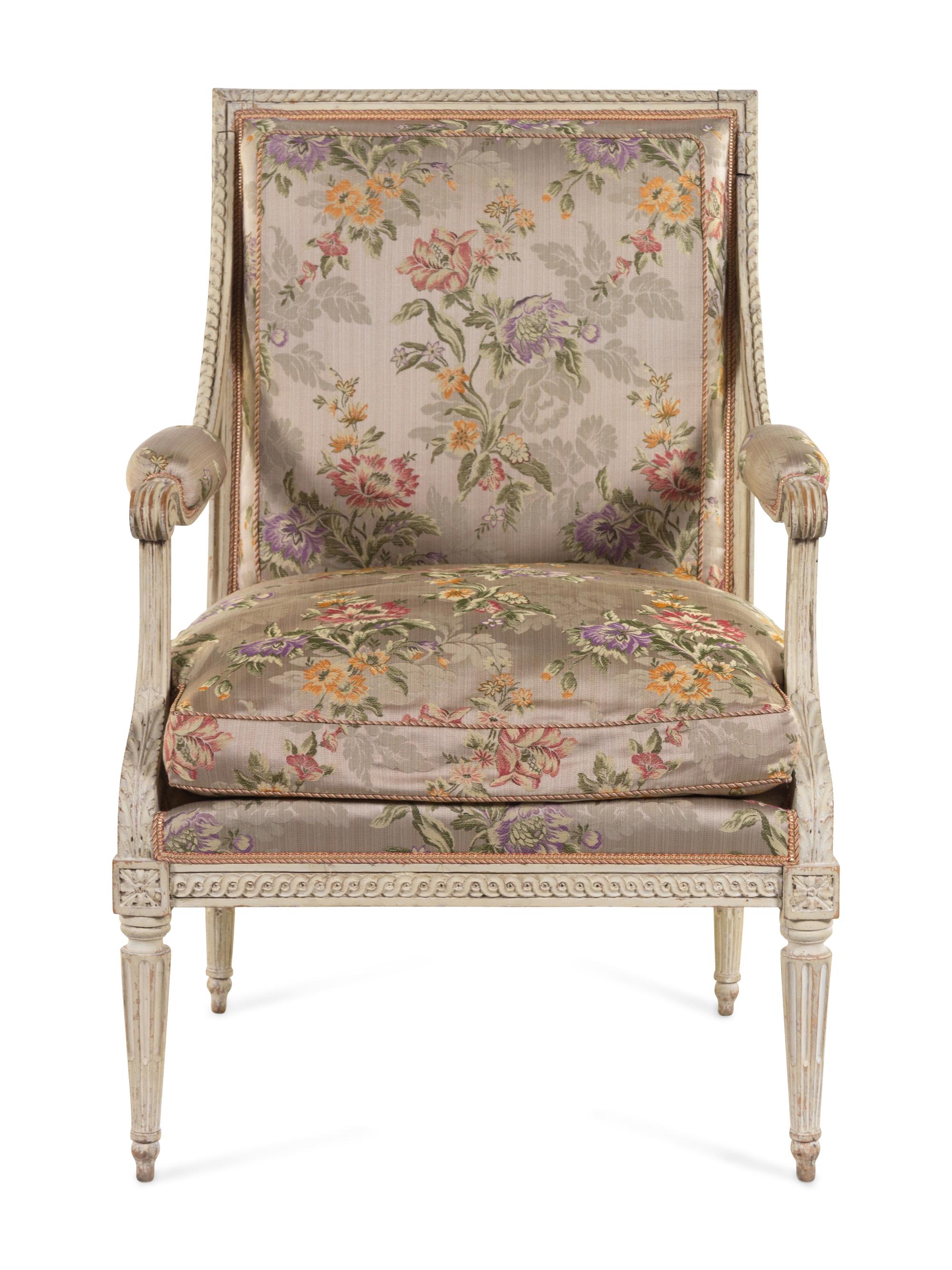 A Louis XVI Carved and White-Painted Fauteuil