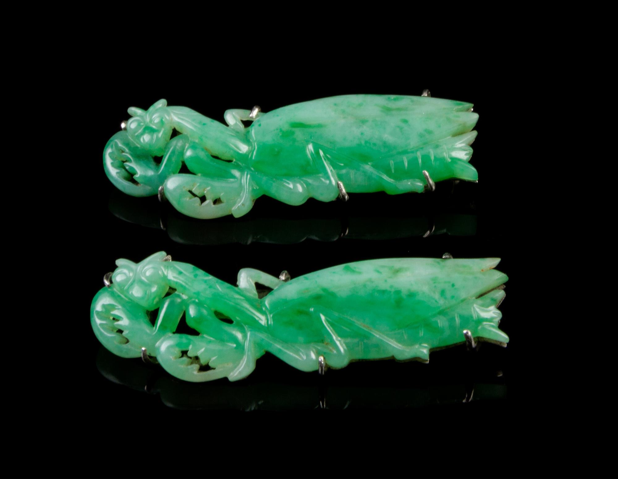 A Pair of Chinese Silver and Jadeite Brooches Length 2 inches.