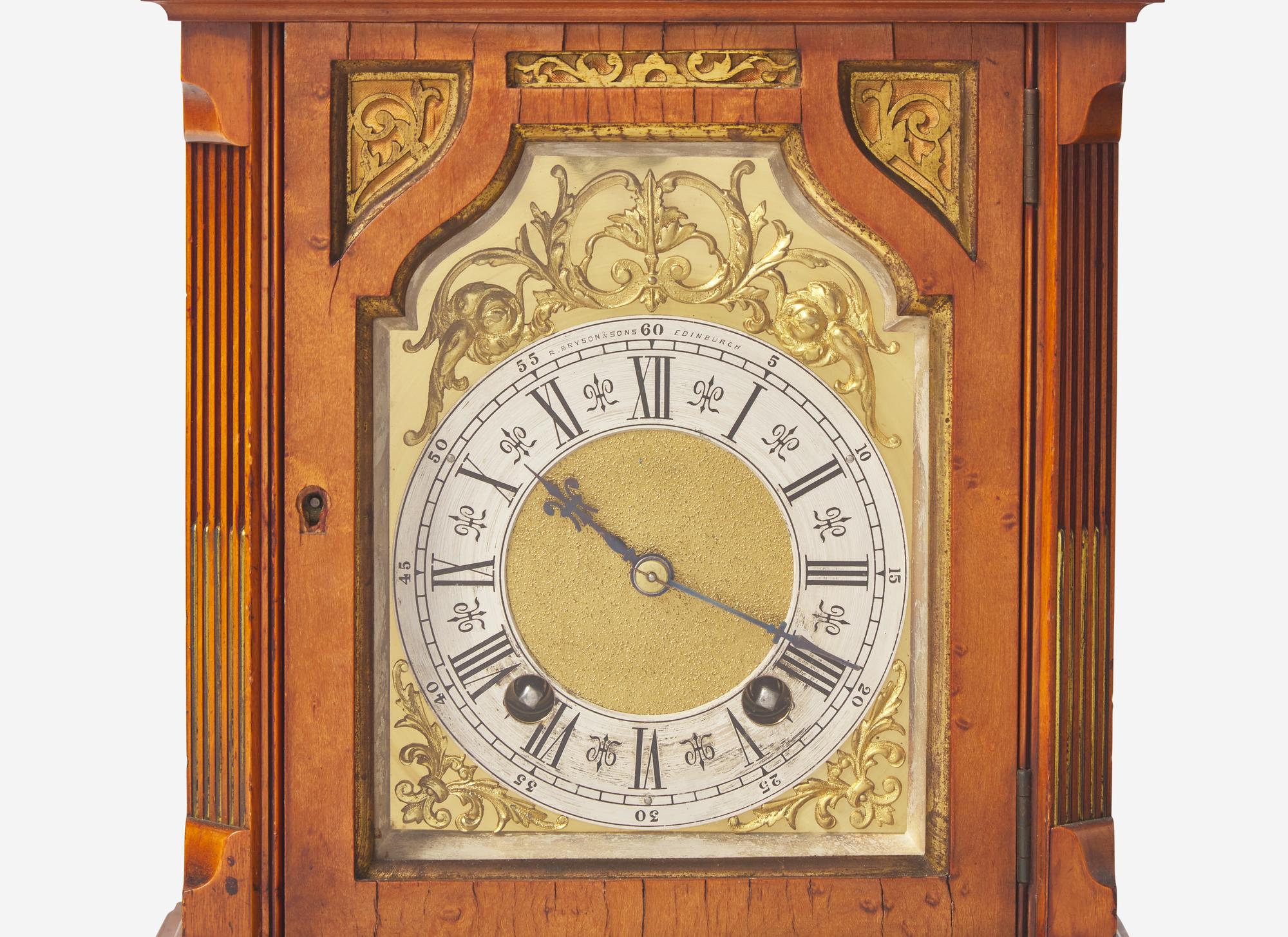 A Scottish Gilt Brass Mounted and Pierce Carved Walnut Mantel Clock