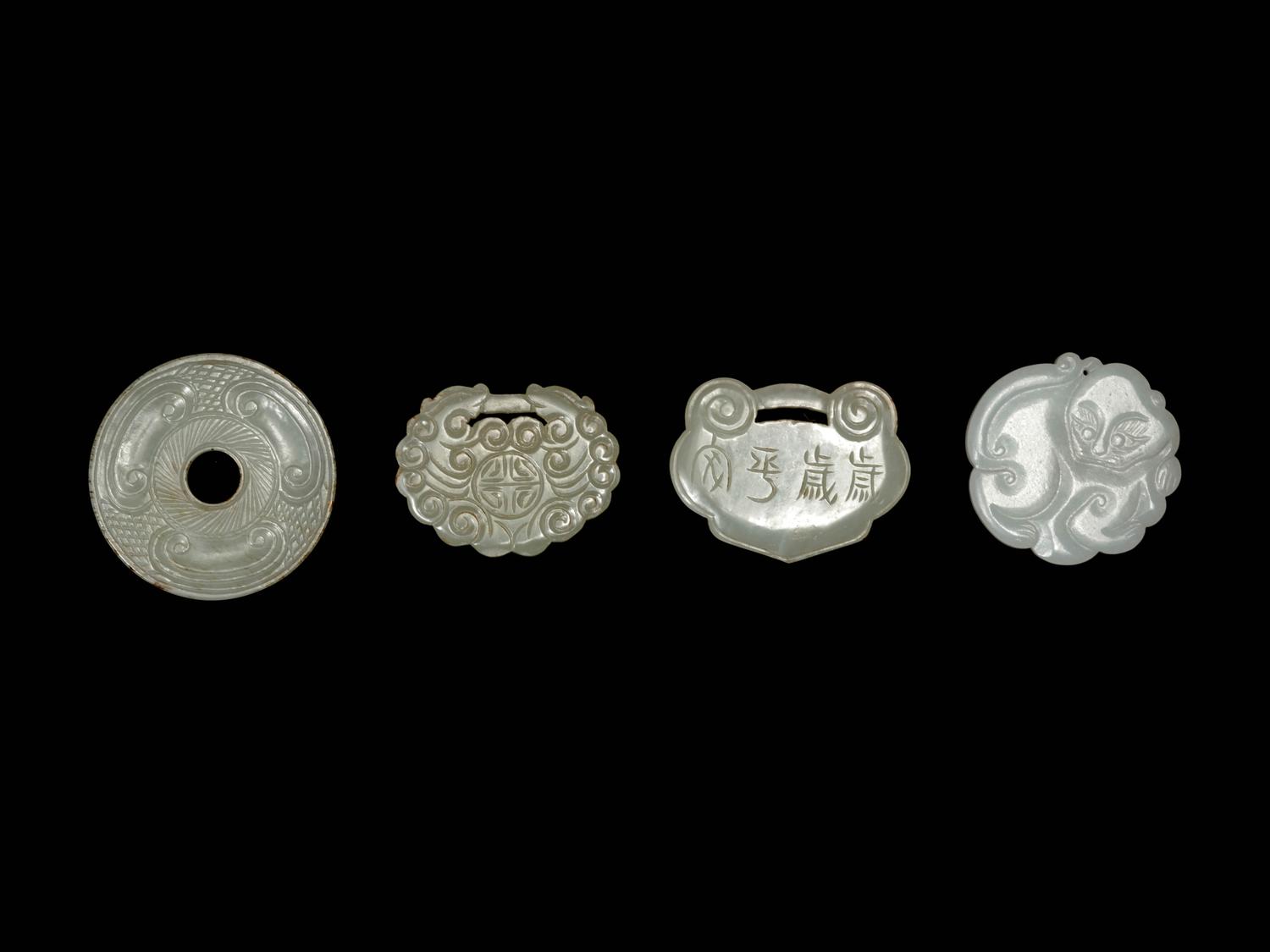 Four Chinese White Jade Pendants
