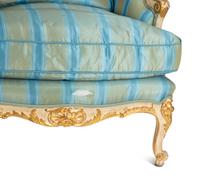 A Pair of Louis XV Style Painted and Parcel Gilt Bergeres