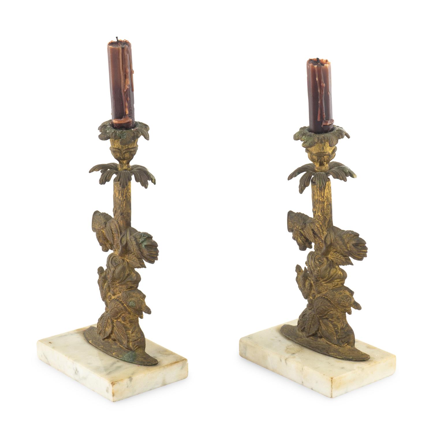 A Pair of Gilt Metal Candlesticks