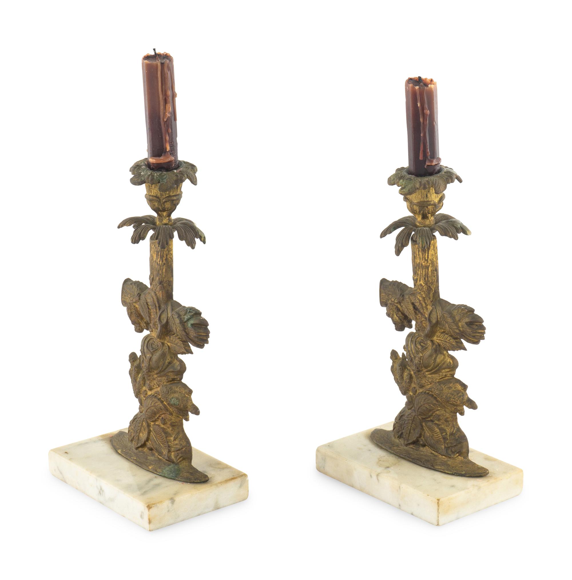 A Pair of Gilt Metal Candlesticks