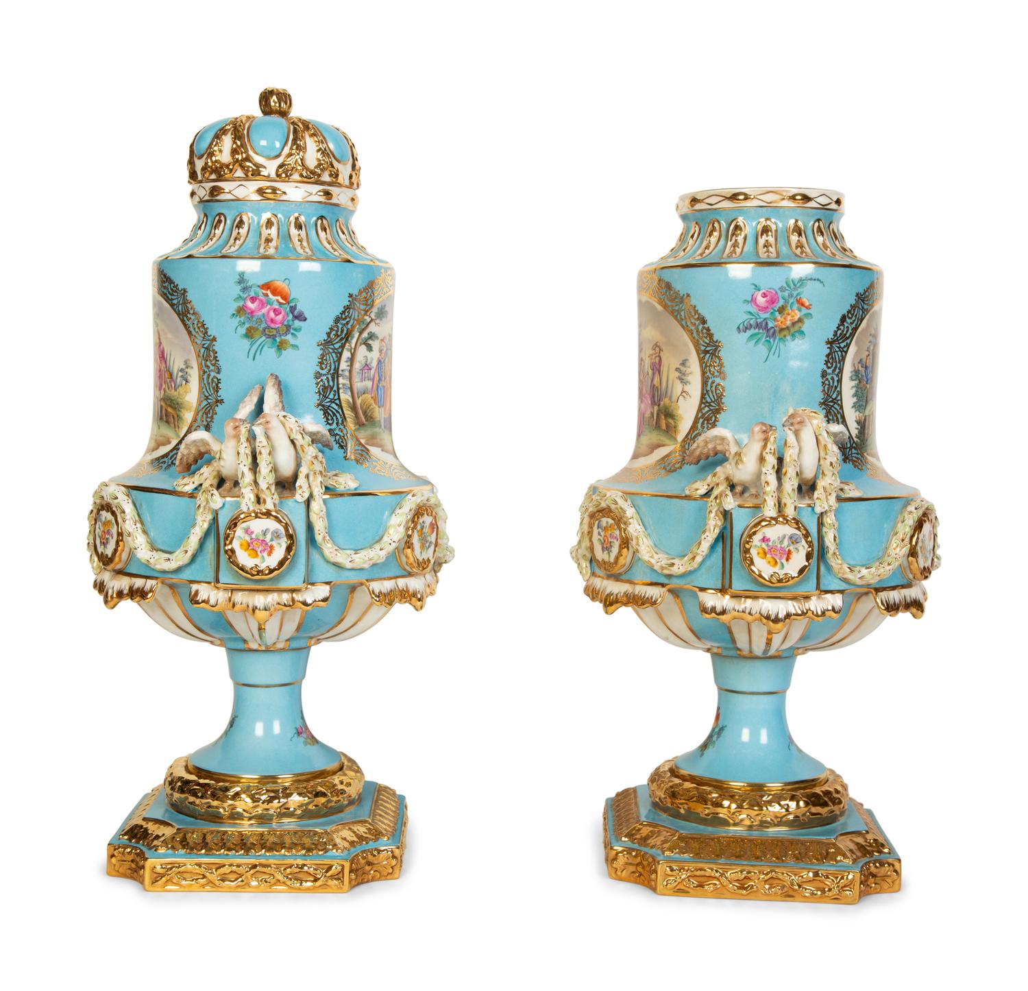 A Pair of Sèvres Style Porcelain Urns