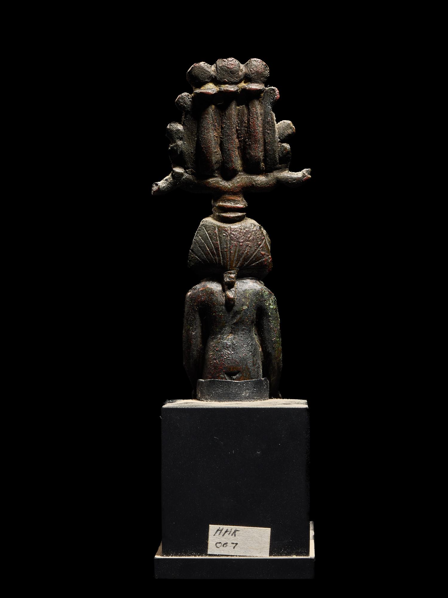 An Egyptian Bronze Seated Harpocrates