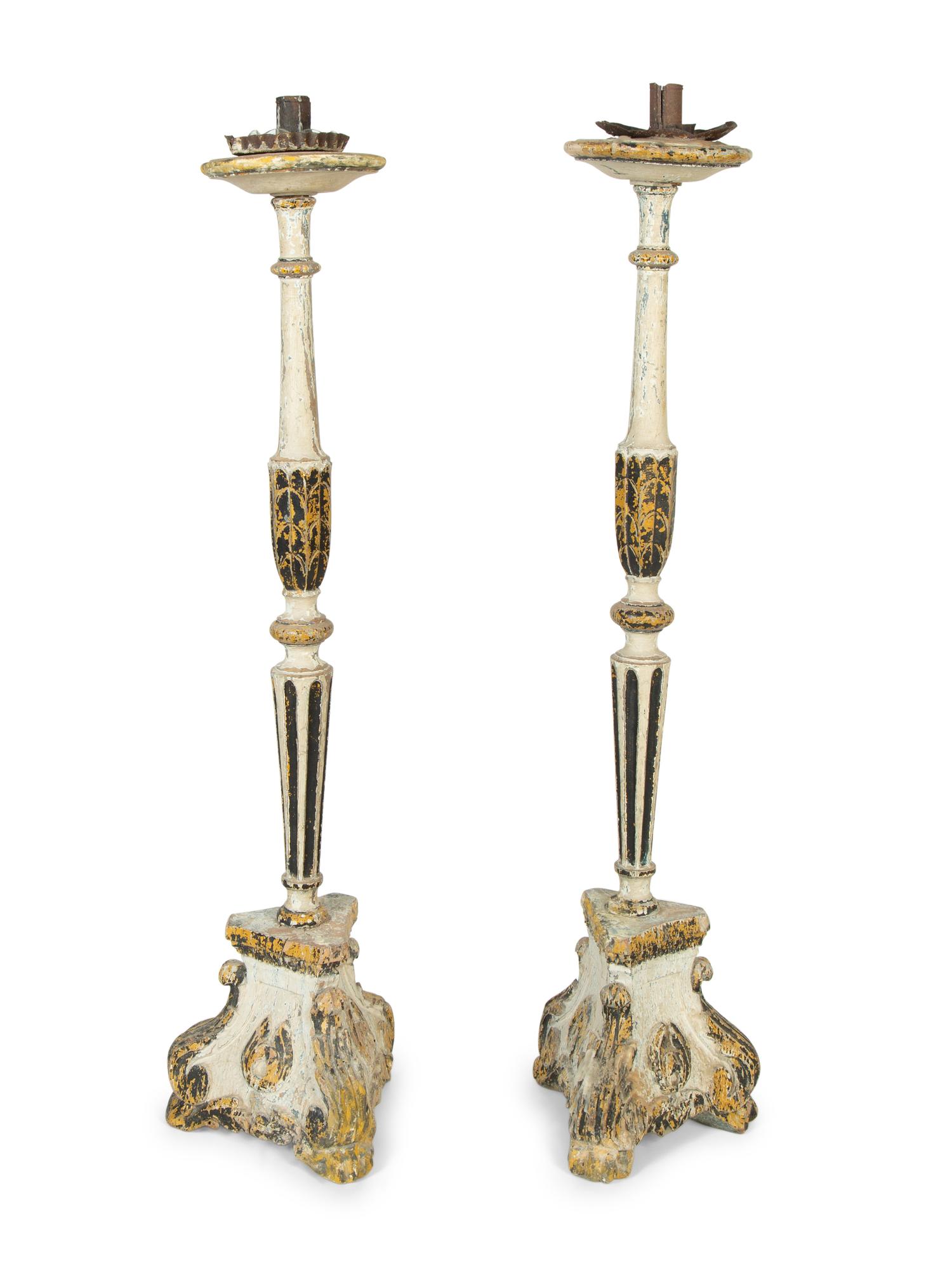 A Pair of Continental Painted Prickets