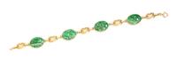 A 14 Karat Yellow Gold and Jade Bracelet, 7.30 dwts.