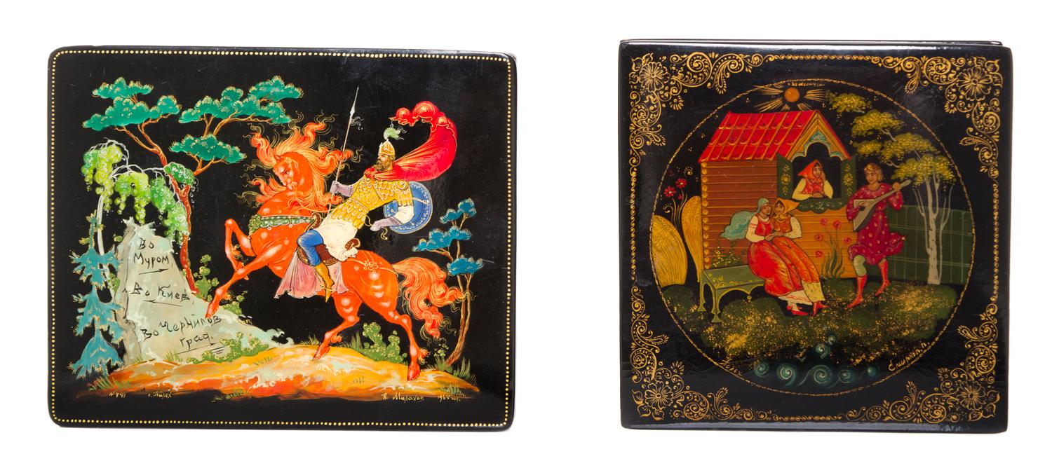 A Collection of Four Russian Lacquered Boxes, 20th Century, each of rectangular form with hinged lid, decorated with folk scenes.