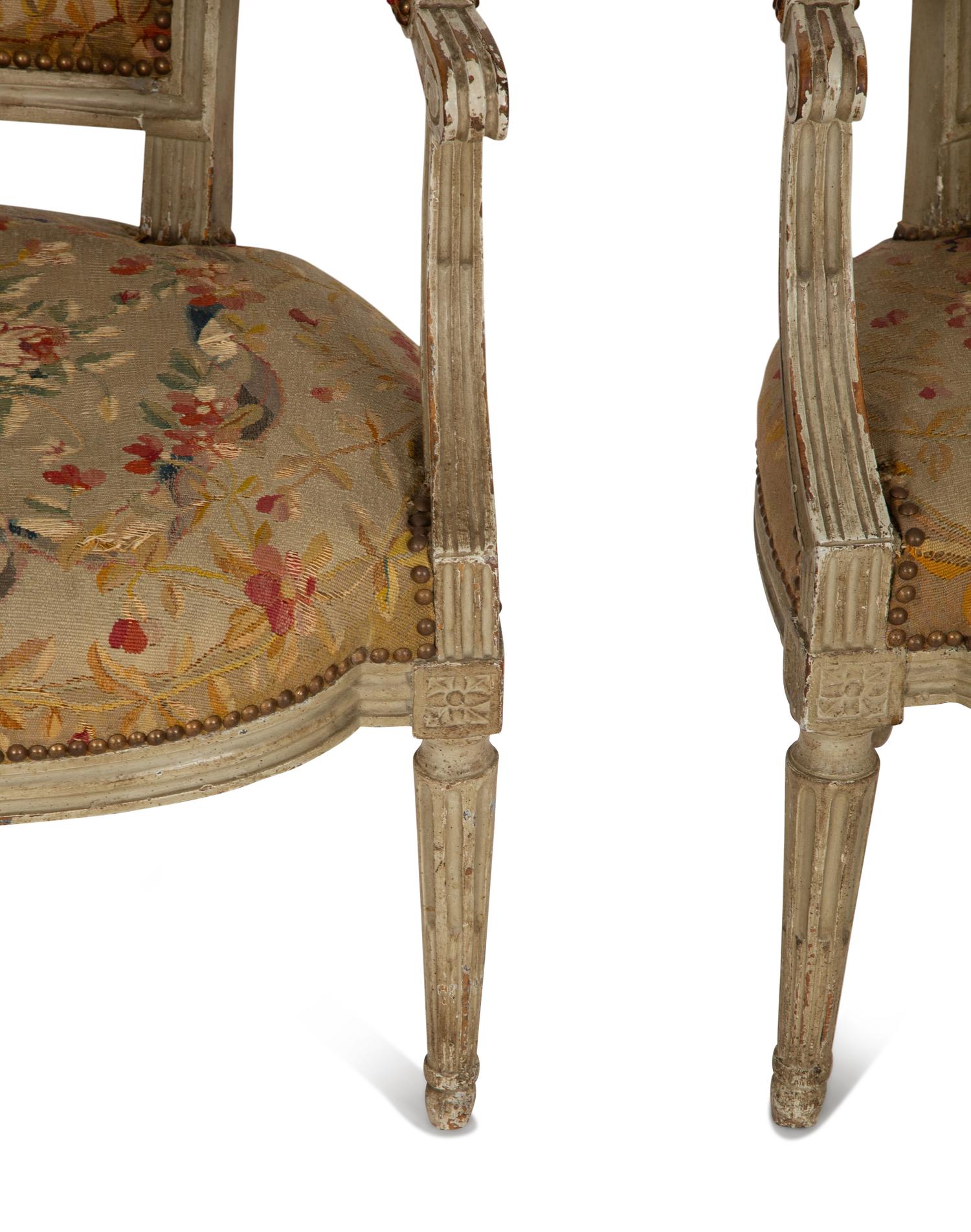A Pair of Louis XVI Painted Fauteuils