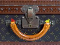 A Louis Vuitton Monogram Canvas Hardside Suitcase — 20TH CENTURY