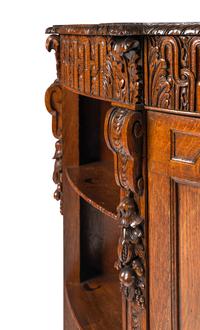 A Continental Carved Oak Demilune Cabinet