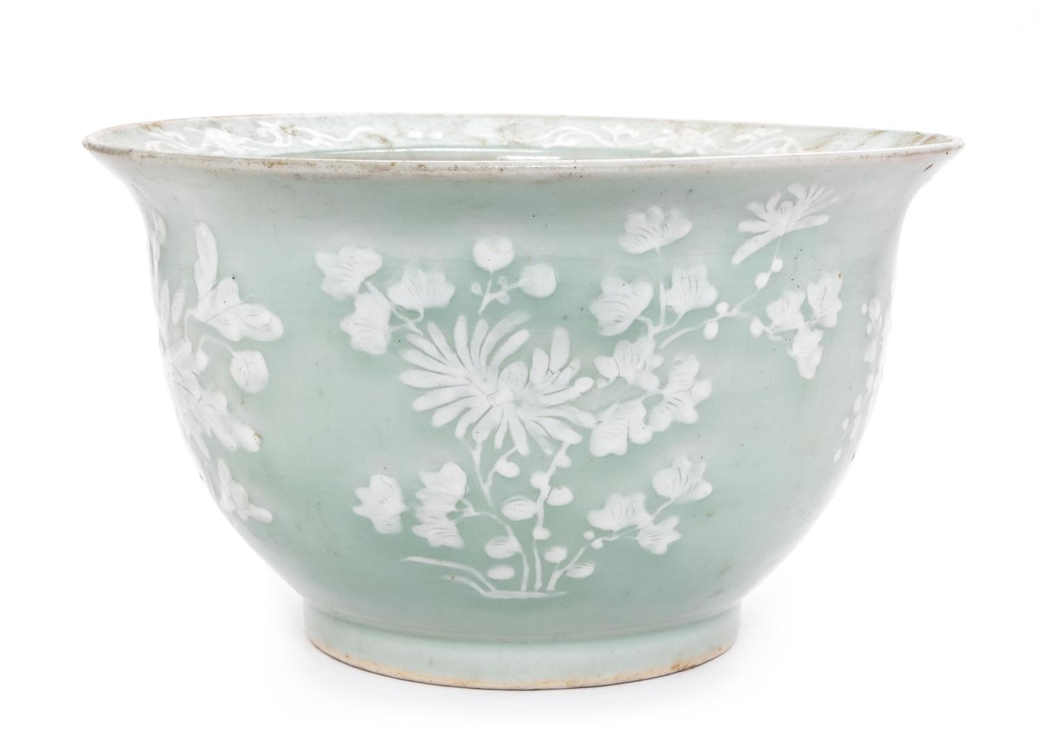 A Chinese White Slip Decorated Celadon Ground Cachepot Diameter 11 1/8 inches.