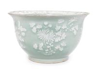 A Chinese White Slip Decorated Celadon Ground Cachepot Diameter 11 1/8 inches.