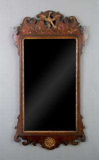 An American Mahogany and Parcel Gilt Chippendale Style Mirror, Height 42 x width 22 1/2 inches.