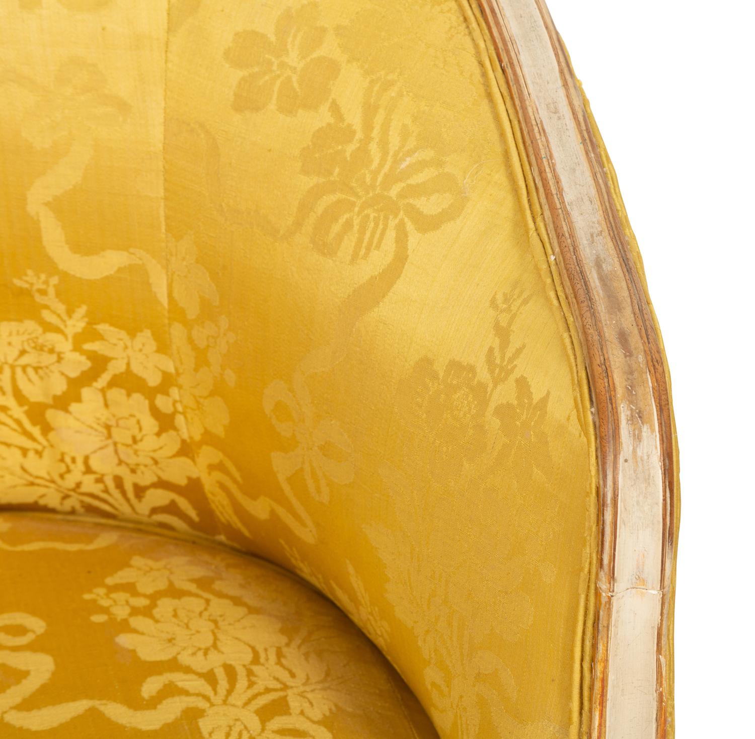 A Louis XV Style Painted and Parcel Gilt Barrel Back Bergere