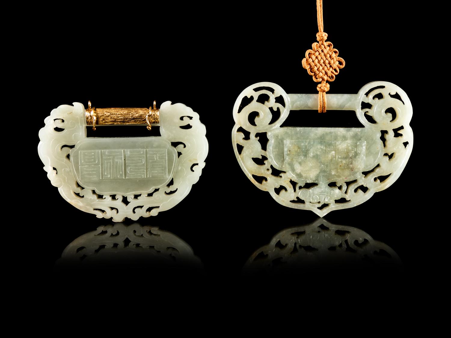 Two Carved Jade Ruyi Lock-Form Pendants