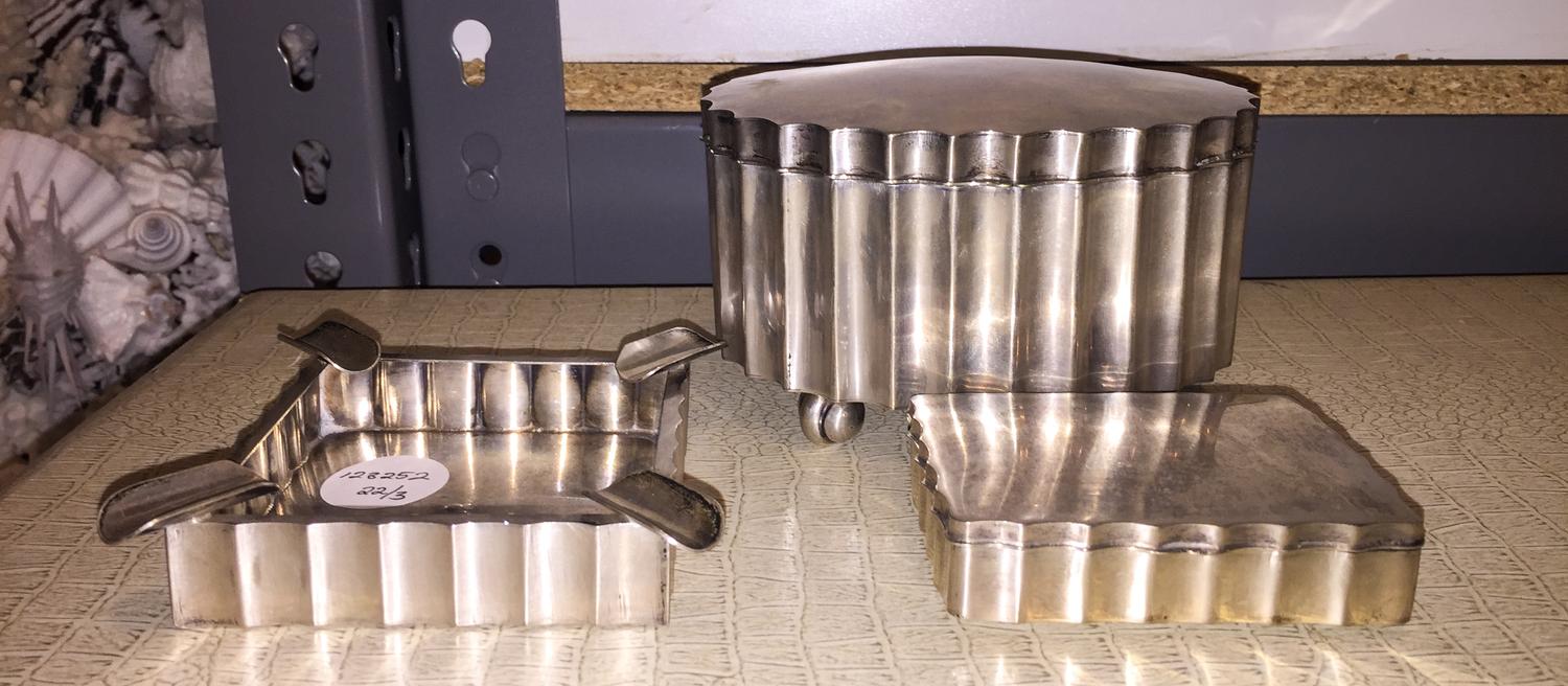 Three Polish Silver Smoking Articles, Krakow, Early 20th Century, comprising two hinged caskets and an ash receiver.