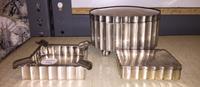 Three Polish Silver Smoking Articles, Krakow, Early 20th Century, comprising two hinged caskets and an ash receiver.