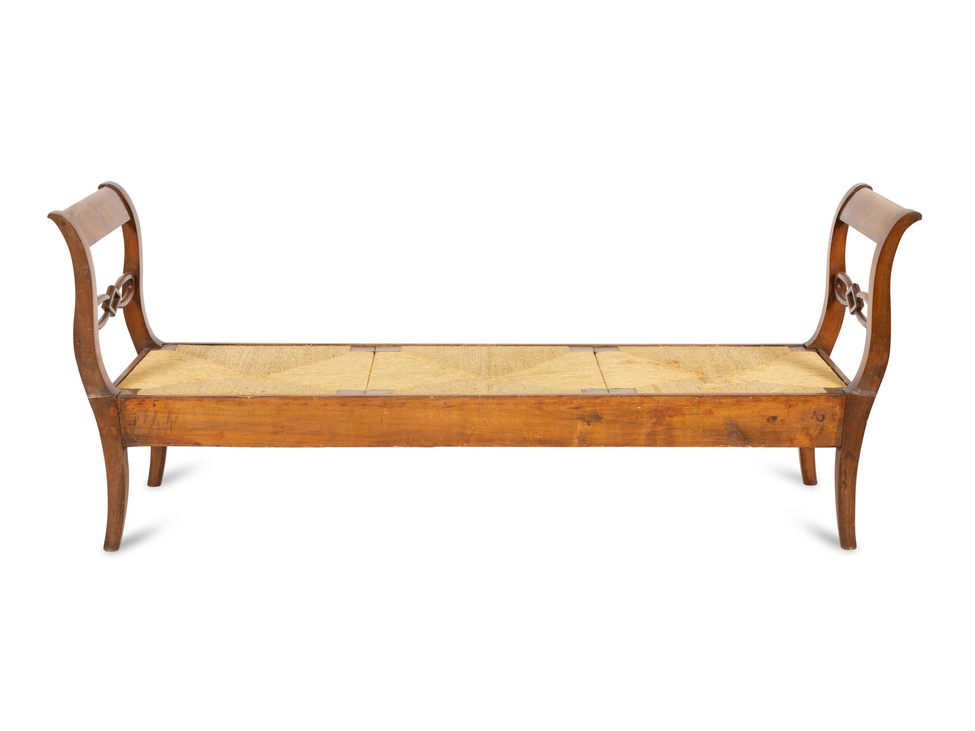 A Northern European Carved Walnut Bench with Rush Seat