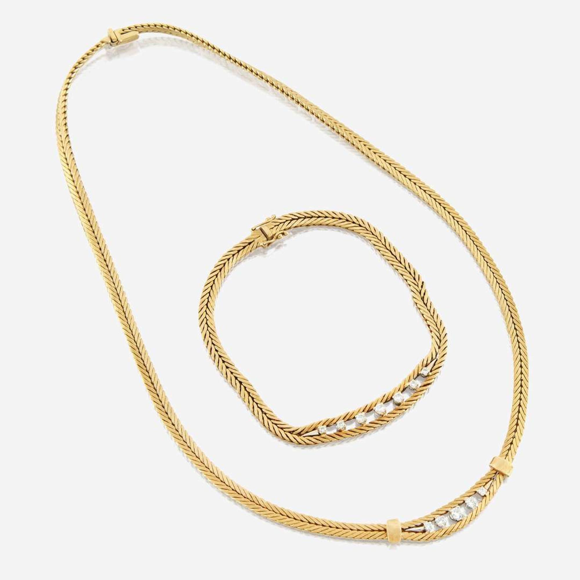 A gold and diamond necklace with matching bracelet Italy
