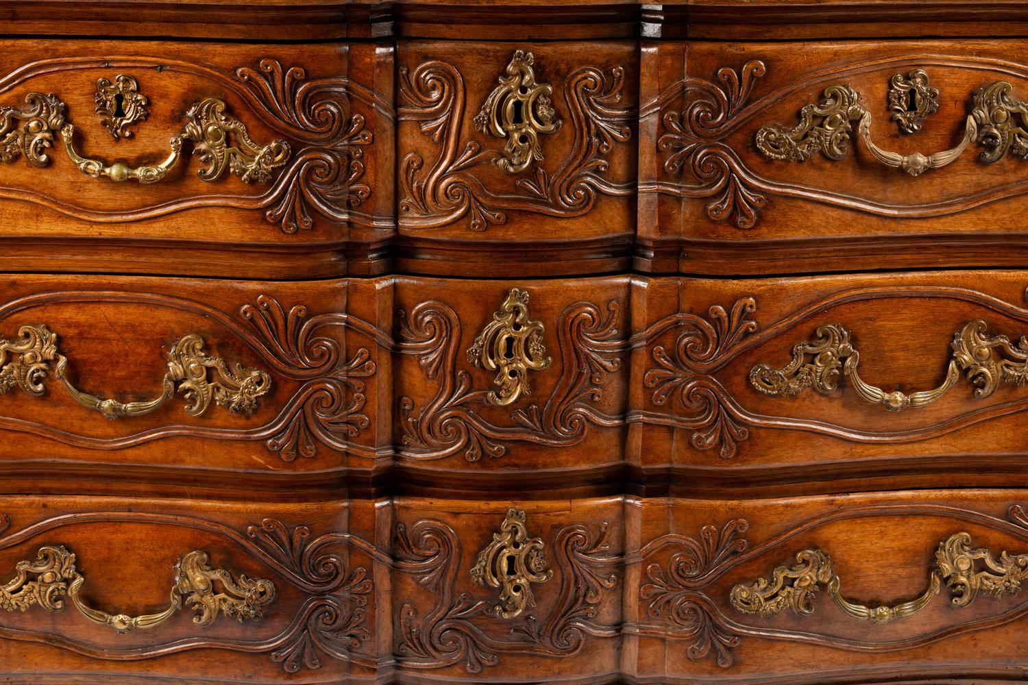 A Louis XV Provincial Carved Walnut Commode
