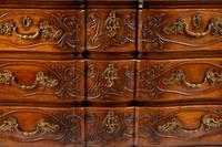 A Louis XV Provincial Carved Walnut Commode