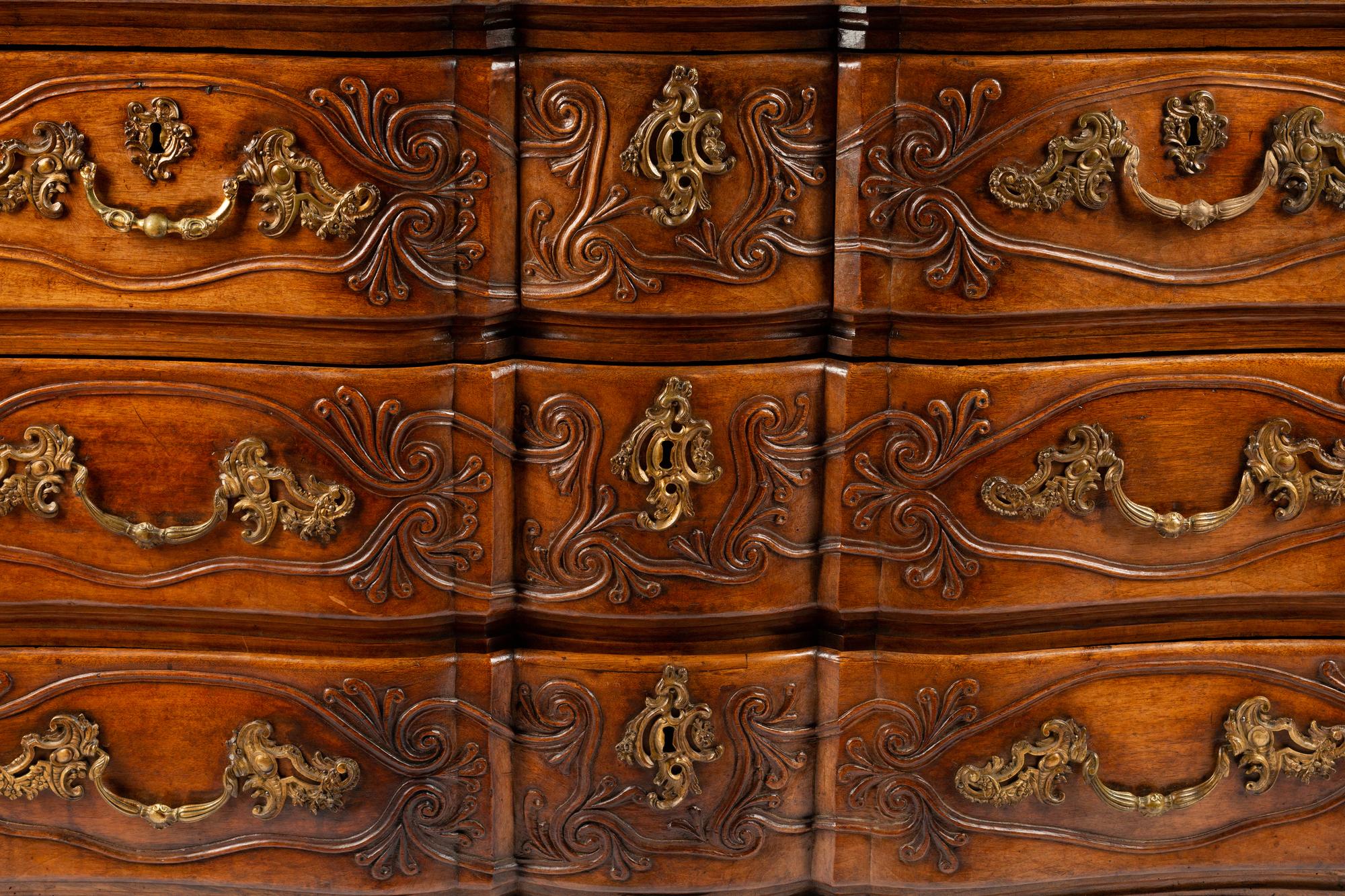A Louis XV Provincial Carved Walnut Commode