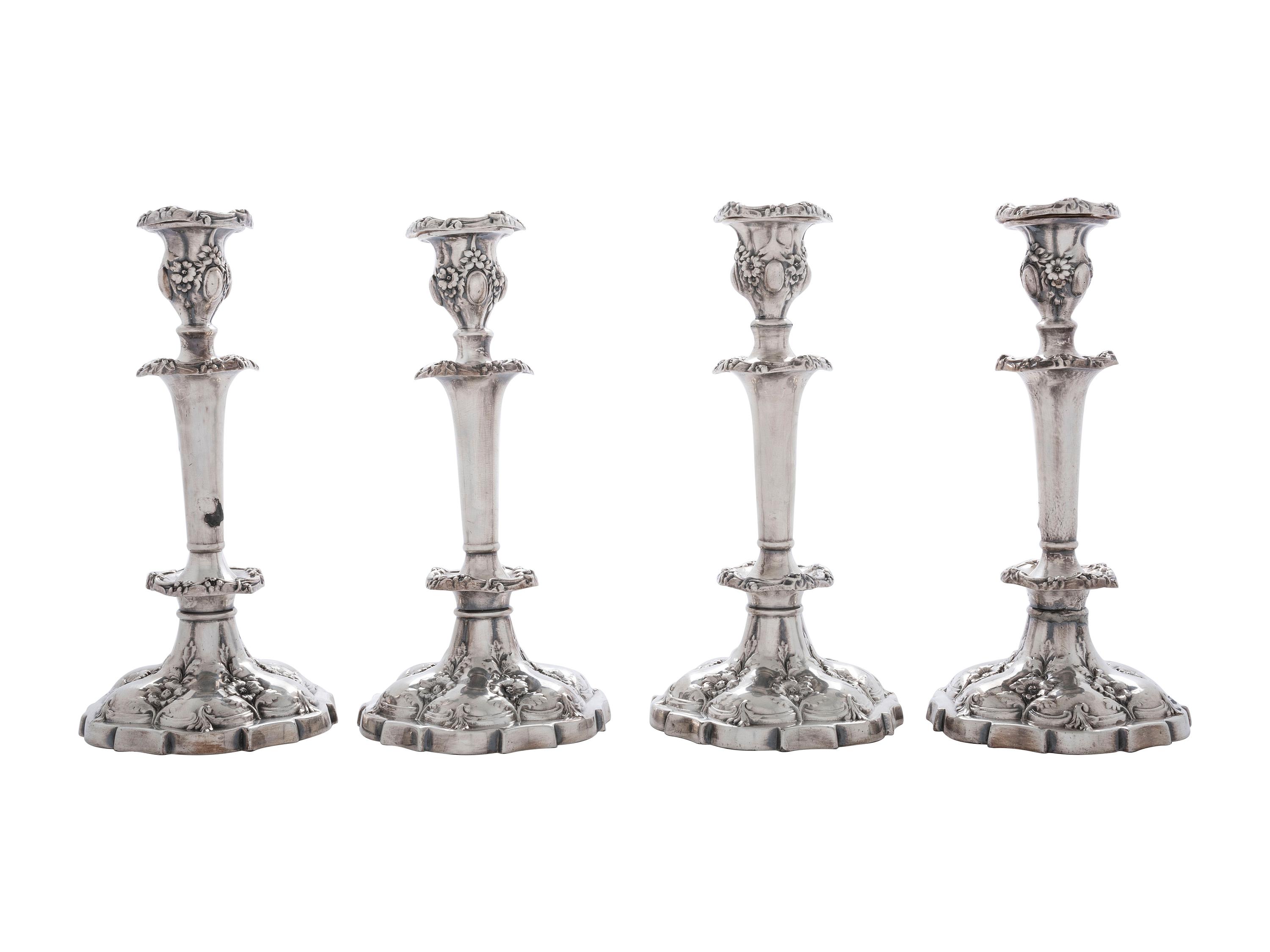 Four Silverplated Weighted Candlesticks and a Silverplated Tray