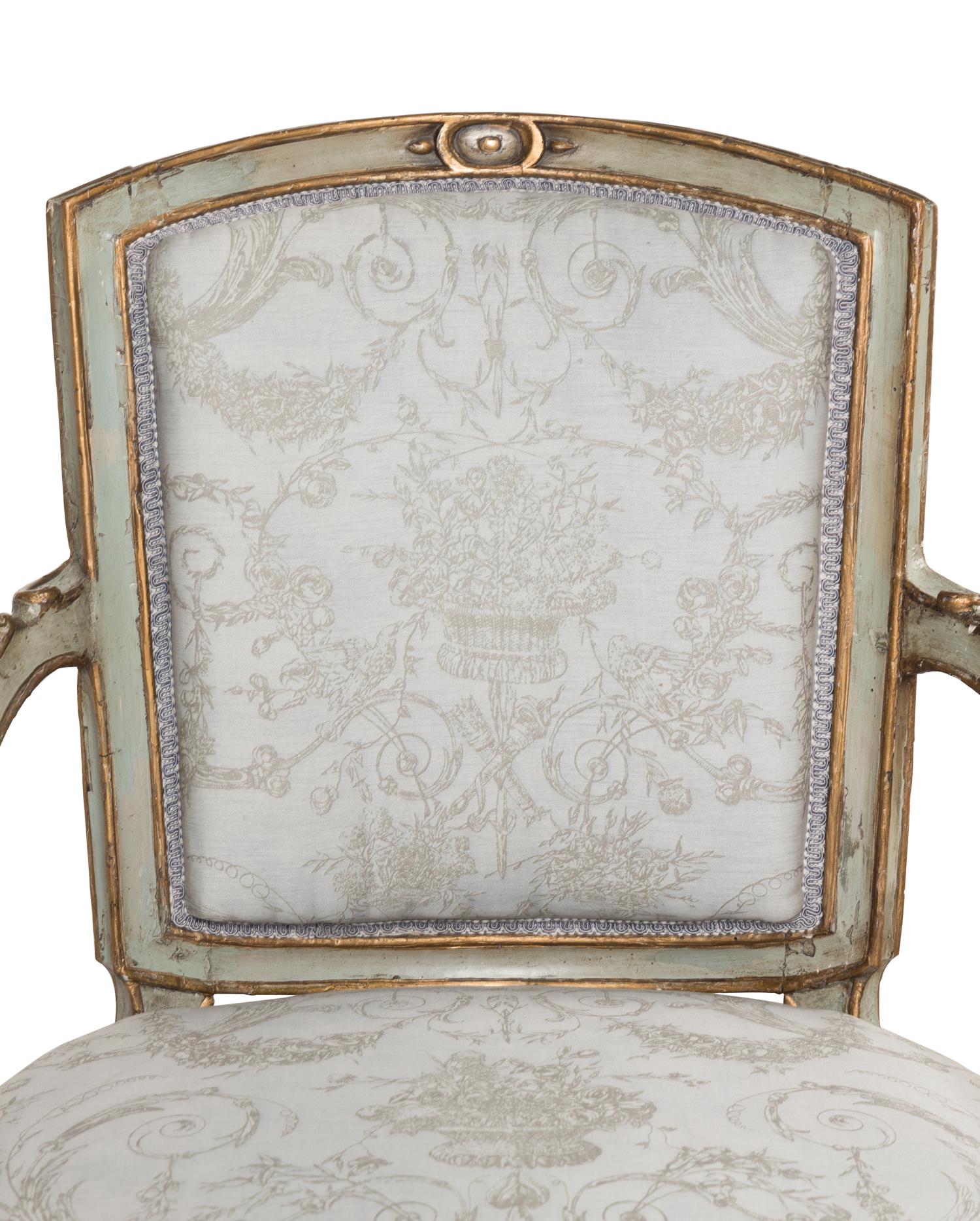 A Pair of Italian Neoclassical Painted and Parcel-Gilt Armchairs