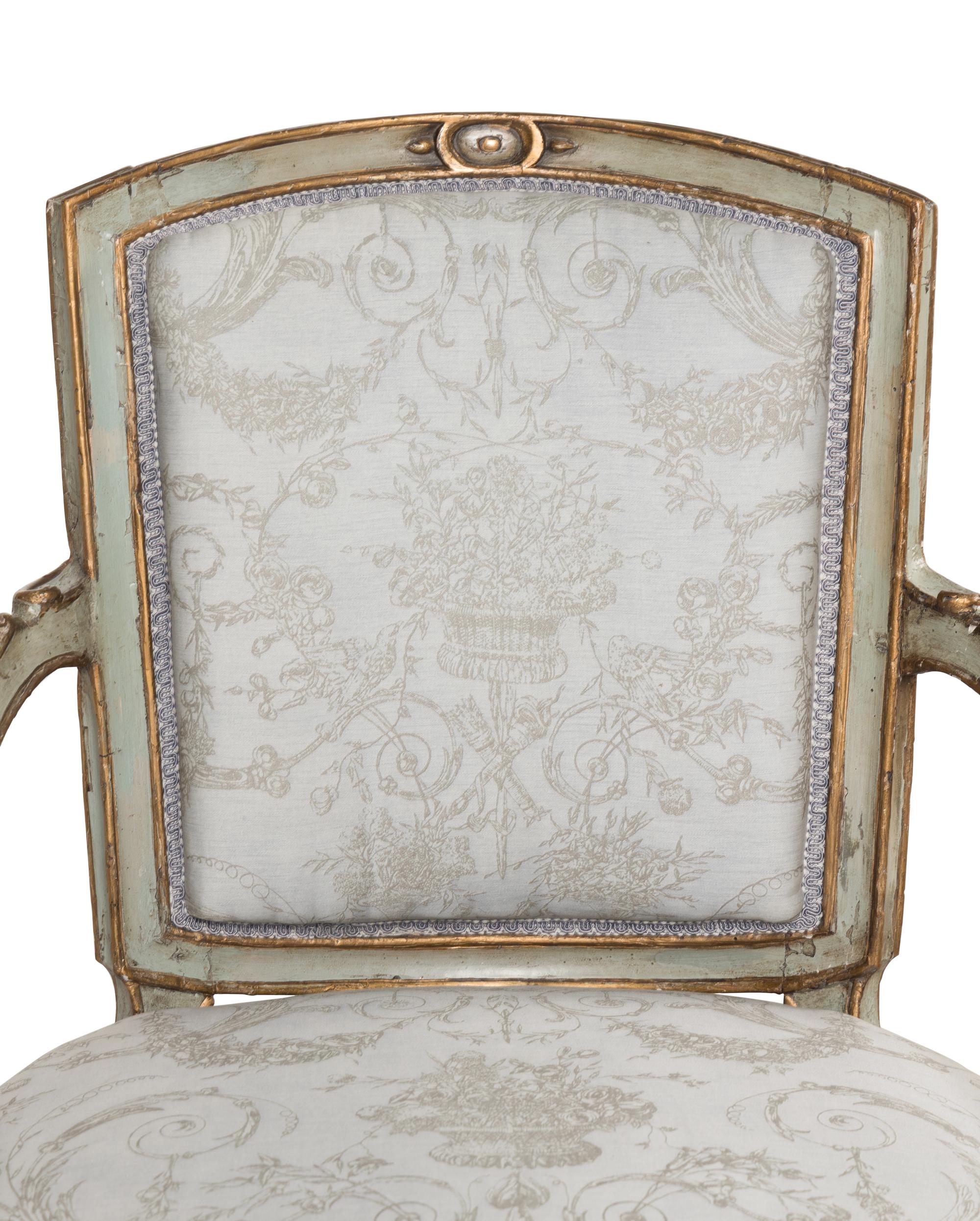 A Pair of Italian Neoclassical Painted and Parcel-Gilt Armchairs