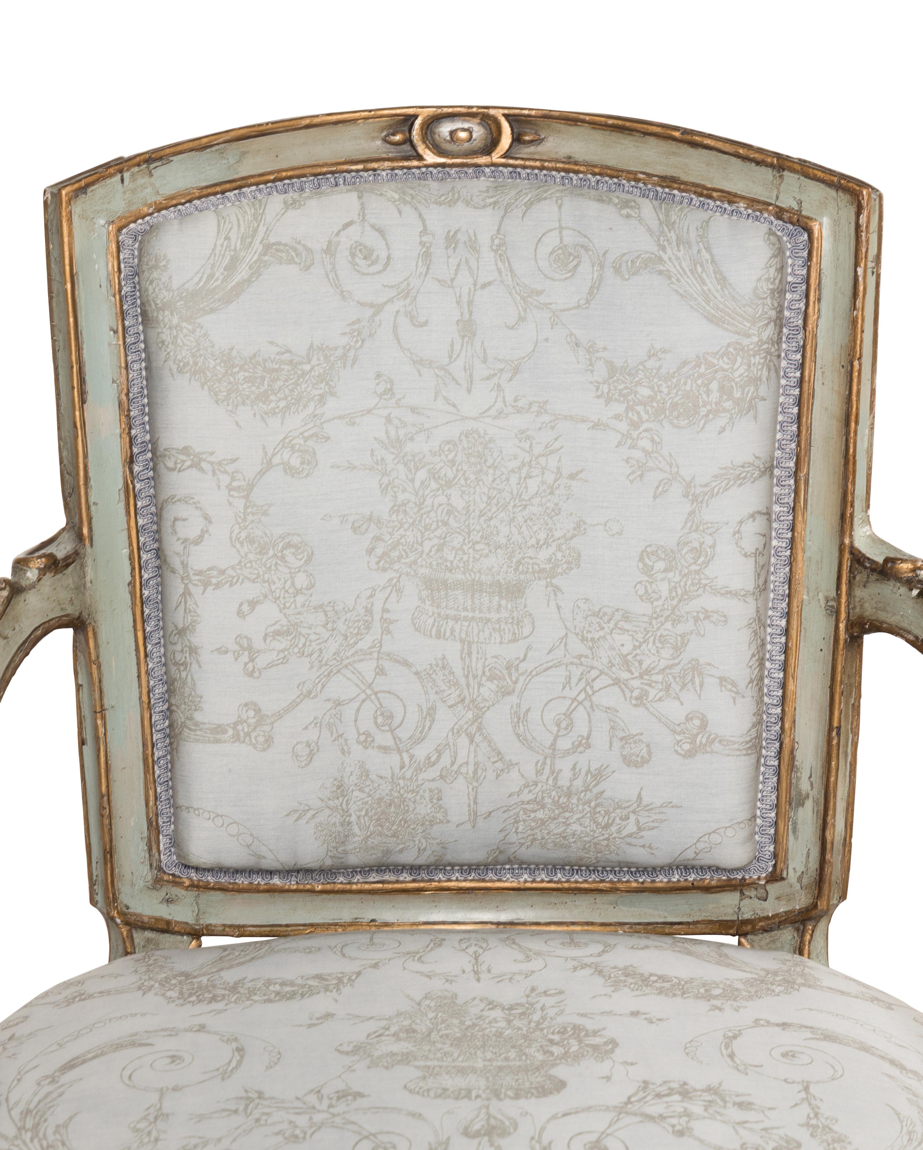 A Pair of Italian Neoclassical Painted and Parcel-Gilt Armchairs