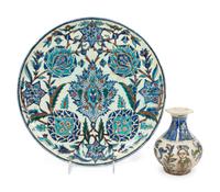 An Islamic Iznik Glazed Pottery Plate and a Small Vase