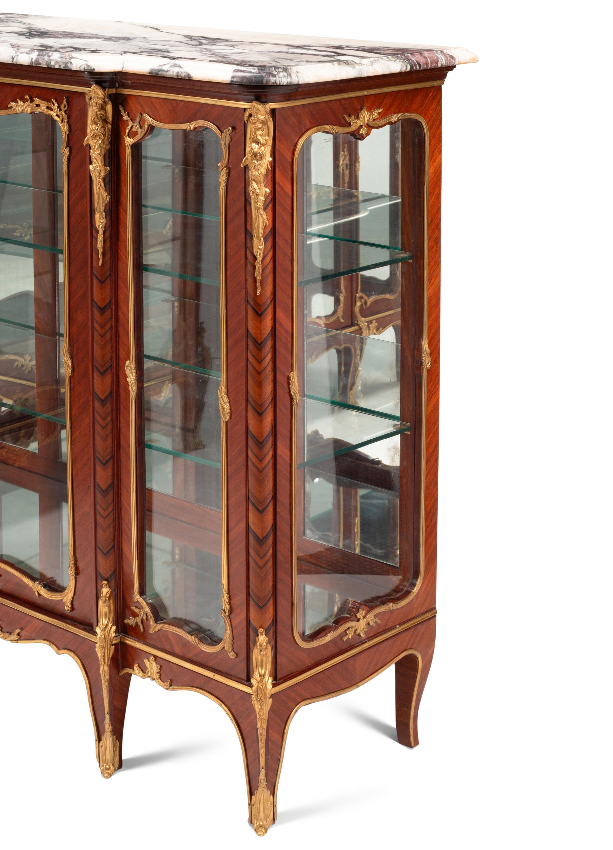 A Pair of Louis XV Style Gilt Bronze Mounted Kingwood Marble-Top Vitrine Cabinets