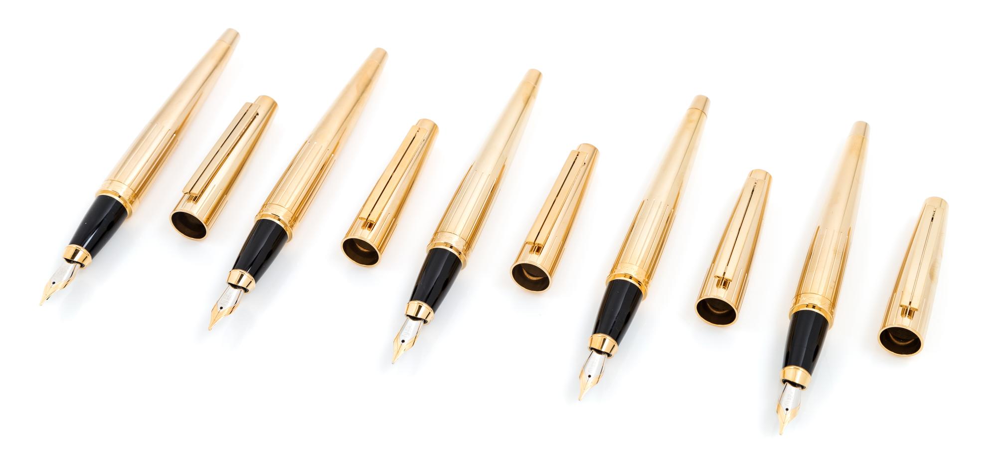 A Group of Five S.T. Dupont Gold-Plated Ellipsis Fountain Pens